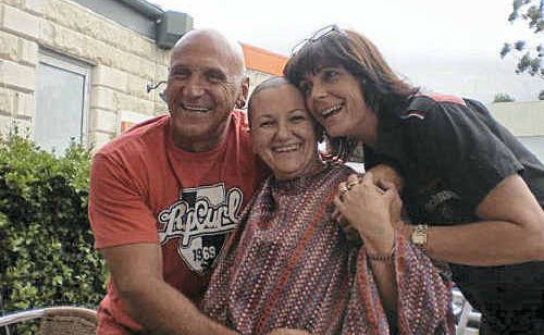 Craig Delaney with Wendy Amos, whose head was shaved by Jennifer Ryan at a fundraiser last Tuesday. Craig Delaney with Wendy Amos, whose head was shaved by Jennifer Ryan at a fundraiser last Tuesday.
